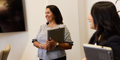 Women conversing during a meeting