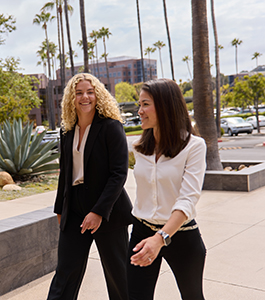 Two female employees walking together