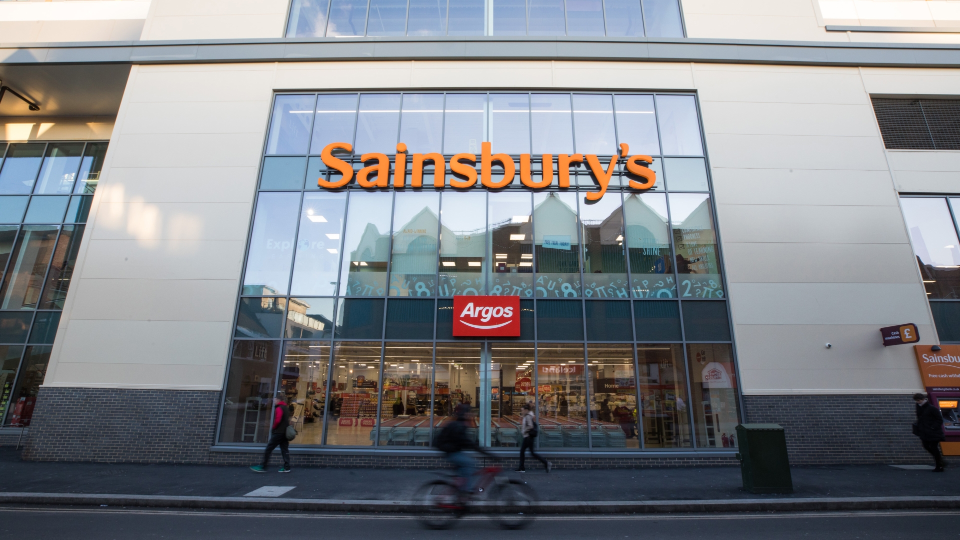 Image taken looking up at the front of a Sainsbury's store