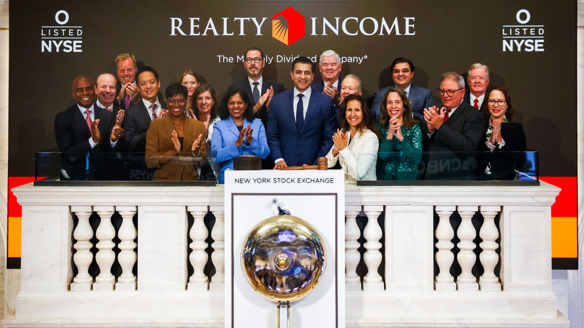 Group of people standing at the NYSE after opening bell